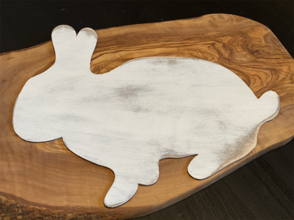 wood cut shaped bunny painted white and distressed with a brown