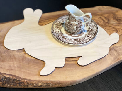 wood cut shaped bunny plain unfinished with a brown and white transferware creamer sitting on a saucer