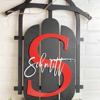 Wood Sled door hanger with either name and monogram or red truck, green tree with name