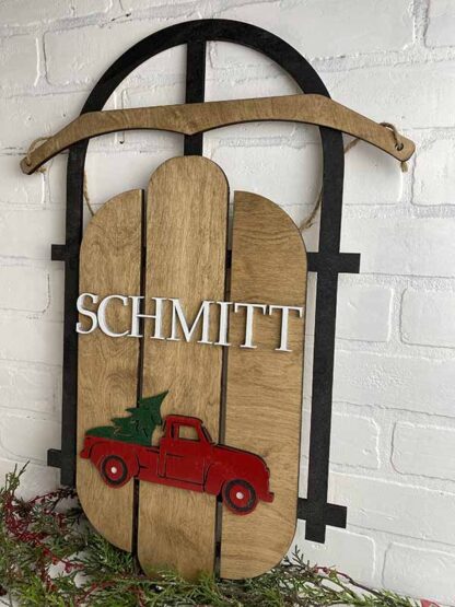 Wood Sled door hanger with either name and monogram or red truck, green tree with name
